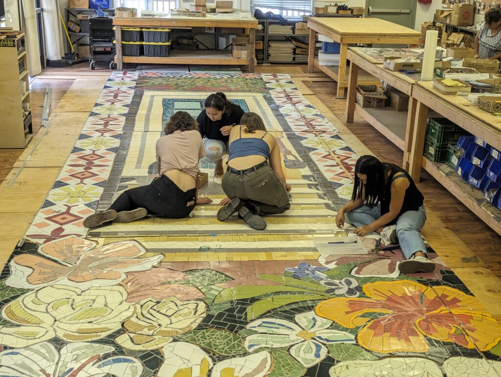 Interns working on the Tabasa Garden Mural