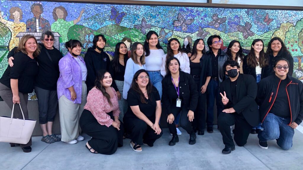 The youth team at PVPSA after the completion of the mural at the PVPSA building in Watsonville.
